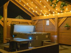 An outdoor space featuring a hot tub and seating at Northumberland Luxury Stays - The Chivits, West Chevington near Amble