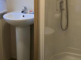 A bathroom with a sink and shower at Port Haverigg Cabin Sleeps 4 Steel Green near Haverigg