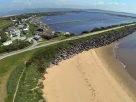 An aerial view of a beach and residential area at Port Haverigg Cabin Sleeps 4 Steel Green near Haverigg