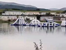 An inflatable water play area on a lake at Port Haverigg Cabin Sleeps 4 Steel Green near Haverigg