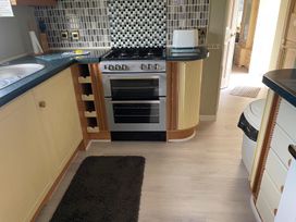 A kitchen with an oven and stove at 2 Bed Lodge Sleeps 5 - Pet Friendly, WiFi, Parking Skegness