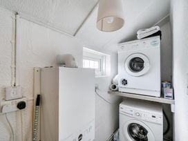A laundry room with a washing machine and dryer at 1 Bed - Sleeps 4 - Parking - Pets - Town Centre, Wadebridge