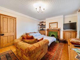 A living room with a sofa and television at 1 Bed - Sleeps 4 - Parking - Pets - Town Centre Wadebridge