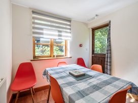 A dining room with a table and chairs at 3-Bed Barn Eco-Lodge on the Tarka trail East Yarde near Great Torrington