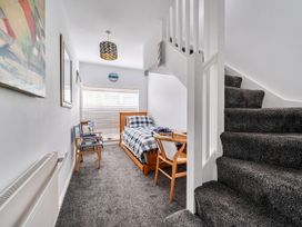 A bedroom with a bed and a staircase at 1 Bed Cottage - Sleeps 2 - Wifi, Malpas near Truro