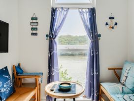A living room with a window and a sofa at 1 Bed Cottage - Sleeps 2 - Wifi Malpas near Truro