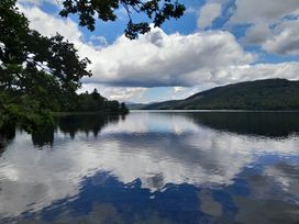 A lake with mountains and clouds at Ye Old'e Man - Sleeps 6 & Pet Friendly Near Flookburgh