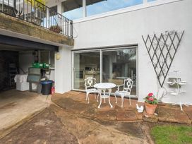 An outdoor seating area with a table and chairs at Apartment Sleeps 2 with Parking, Pets Welcome, Watermillock near Pooley Bridge