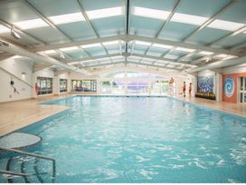 An indoor swimming pool with lifeguards at Caravan Sleeps 5 - Decking, Parking, Pet Friendly in Blackpool