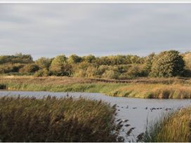 A landscape with water and trees at Caravan Sleeps 5 - Decking, Parking, Pet Friendly, Blackpool