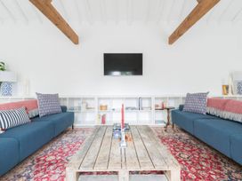 A living room with sofas and a coffee table at Simple Coastal Luxury near Southwold