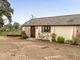 A building exterior with plants at The Shippon, Breathtaking Views, Private Hot Tub in Winkleigh