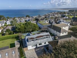 An aerial view of houses near the ocean at 2 Bedroom Apartment Sleeps 3 Garden Pets Carbis Bay