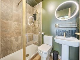 A bathroom with shower toilet and sink at 2 Bedroom Apartment Sleeps 3 Garden Pets Carbis Bay