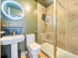 A bathroom with a sink, toilet, and shower at 2 Bedroom Apartment Sleeps 3 Garden Pets Carbis Bay