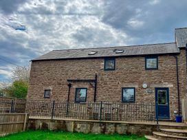 A house with stone walls and windows at Cottage Sleeps 6 Garden Parking Beaulieu Farm near Coleford