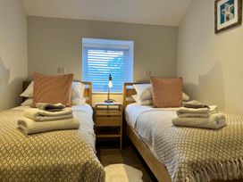 A bedroom with two single beds and a nightstand at Cottage Sleeps 6 Garden Parking Beaulieu Farm near Coleford