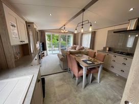 A living room and dining area with a sofa and table at unknown location