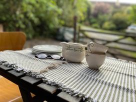 A table with a pitcher and teacup at 