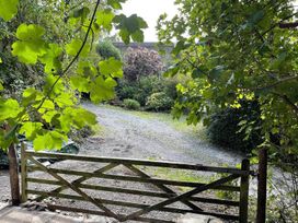 A garden with a gate and a gravel path at 