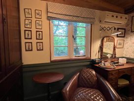 An office with a desk and chair at The Old Barn in Bovey Tracey