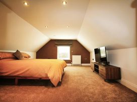 A bedroom with a bed and television at Newly Refurbished Cottage, sleeping 4 and Central Berwick-Upon-Tweed