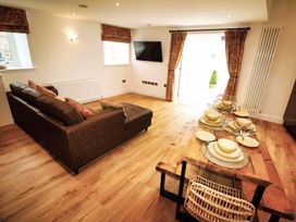 A living room with a sofa and dining table at Newly Refurbished Cottage, sleeping 4 and Central Berwick-Upon-Tweed