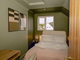 A bedroom with a bed and window at 1 Bedroom Apartment, sleeping 3 with balcony and pet friendly in Carbis Bay