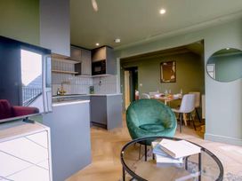A kitchen with modern appliances and dining area at 1 Bedroom Apartment, sleeping 3 with balcony and pet friendly, Carbis Bay