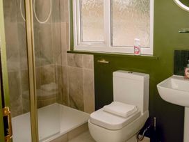 A bathroom with shower, toilet, and sink at 1 Bedroom Apartment, sleeping 3 with balcony and pet friendly, Carbis Bay