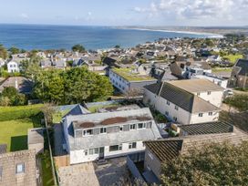 An aerial view of houses near the ocean at 1 Bedroom Apartment, sleeping 3 with balcony and pet friendly, Carbis Bay