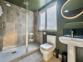 A bathroom with a shower, toilet, and sink at 1 Bedroom Apartment, sleeping 3 with balcony and pet friendly, Carbis Bay