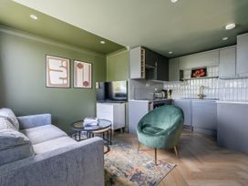 A living room with a sofa and coffee table at 1 Bedroom Apartment, sleeping 3 with balcony and pet friendly, Carbis Bay