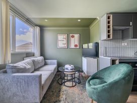 A living room with a sofa and coffee table at 1 Bedroom Apartment, sleeping 3 with balcony and pet friendly in Carbis Bay