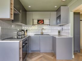 A kitchen with a sink and appliances at 1 Bedroom Apartment, sleeping 3 with balcony and pet friendly, Carbis Bay