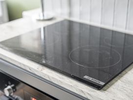 An induction cooktop on a kitchen counter at 1 Bedroom Apartment, sleeping 3 with balcony and pet friendly in Carbis Bay