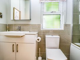 A bathroom with a sink and toilet at 19 Pony Meadow White Cross Bay near Troutbeck Bridge