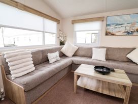 A living room with a sofa and coffee table at B54