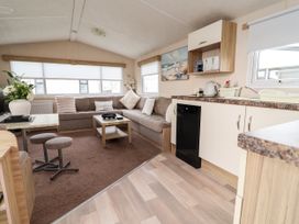 A living room with a sofa and coffee table at B54