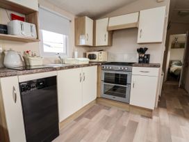 A kitchen with appliances and utensils at B54