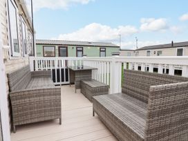 An outdoor seating area with wicker furniture at B54