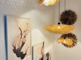 A room with wall art and light fixtures at Muddy Boots – Arcade Royale, Kirby Stephen