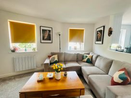 A living room with a sofa and coffee table at Muddy Boots – Scarpa, Kirkby Stephen