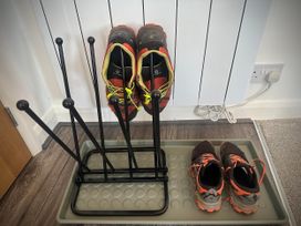 A shoe rack with shoes at Muddy Boots – Scarpa, Kirkby Stephen