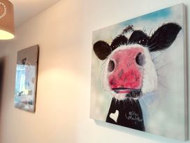 A cow painting and wall art at Muddy Boots – Scarpa, Kirkby Stephen