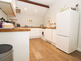 A kitchen with appliances and countertop at Peewit Barn Moreton-in-Marsh