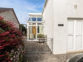 An outdoor area with a gate and door at Hafan y Tyddyn