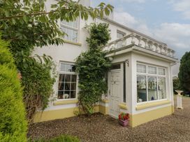 An exterior view of a house with a door and windows at Bruckless Rest Fine Country Dining B&B Bruckless