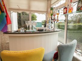 A bar area with bottles and glasses at Bruckless Rest Fine Country Dining B&B in Bruckless