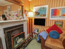 A living room with a fireplace and a sofa at Bruckless Rest Fine Country Dining B&B Bruckless